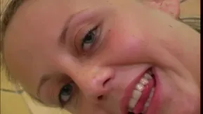 A beautiful young woman has a bath and plays with a dildo capturing the sensual moment