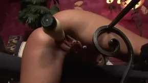 A hot brunette enjoys an intimate moment with her sex toys