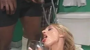 A shower of cum on the blondie's pussy in the toilet close up