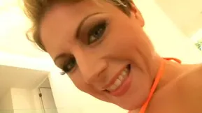 Beautiful brunette with blue eyes fucks in her swimsuit and gets a facial