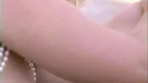 Two friends have fun and get intimate by the pool enjoying every moment