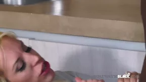 Blonnie Fesser is a white woman who gives a great blow job to a black man.