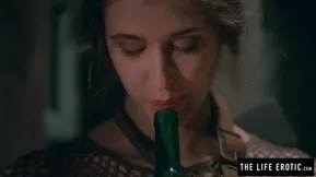 An erotic in the life of a hardcore BDSM slave, a brunette with a bottle erection.