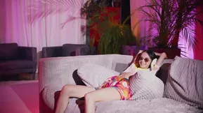 Leona Mia is a young and playful brunette who strips and shows her pretty white skin and legs.