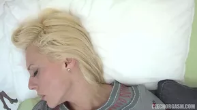 A shaved and young lady enjoys solo pleasure.