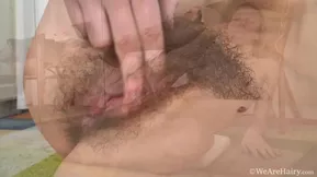 A blue-eyed blonde undresses and masturbates with a finger while spreading her legs.