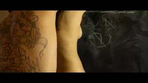 Jimena Lago and Miguel Zayas in a passionate kitchen scene with a large breasted man