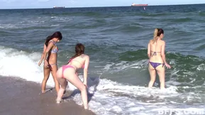Three friends have fun at a beach party and get naughty with a penis sharing experience